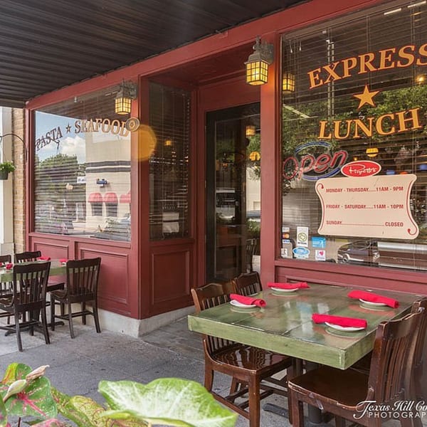 Pignetti's Italian restaurant exterior with outdoor seating, red trim, and 'Express Lunch' sign.